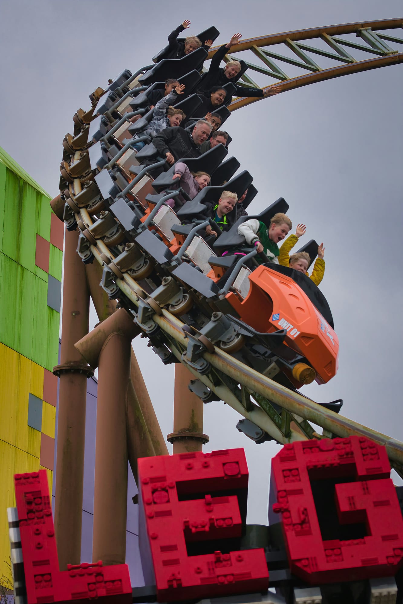 A rollercoaster diving over LEGO letters at LEGOLAND